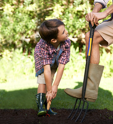 Buy stock photo Child, father and help with gardening in nature using tools for agriculture conservation and ecology education. Soil, compost and a man teaching boy kid to plant with fork for organic earth support 