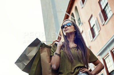Buy stock photo Shopping bag, fashion confidence and woman with clothes purchase, retail product or luxury boutique discount. Urban city, sales spree and chic female customer with glasses, design brand or mall gift