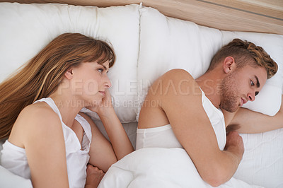 Buy stock photo A young couple disagreeing with each other