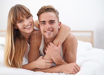 Buy stock photo Couple, embrace and portrait in bed on weekend, happy and bonding for love in relationship at home. People, loyalty and commitment to marriage in bedroom, smiling and romance or comfortable in hug
