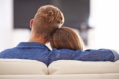 Buy stock photo Cropped shot of a young couple sitting on the couch together