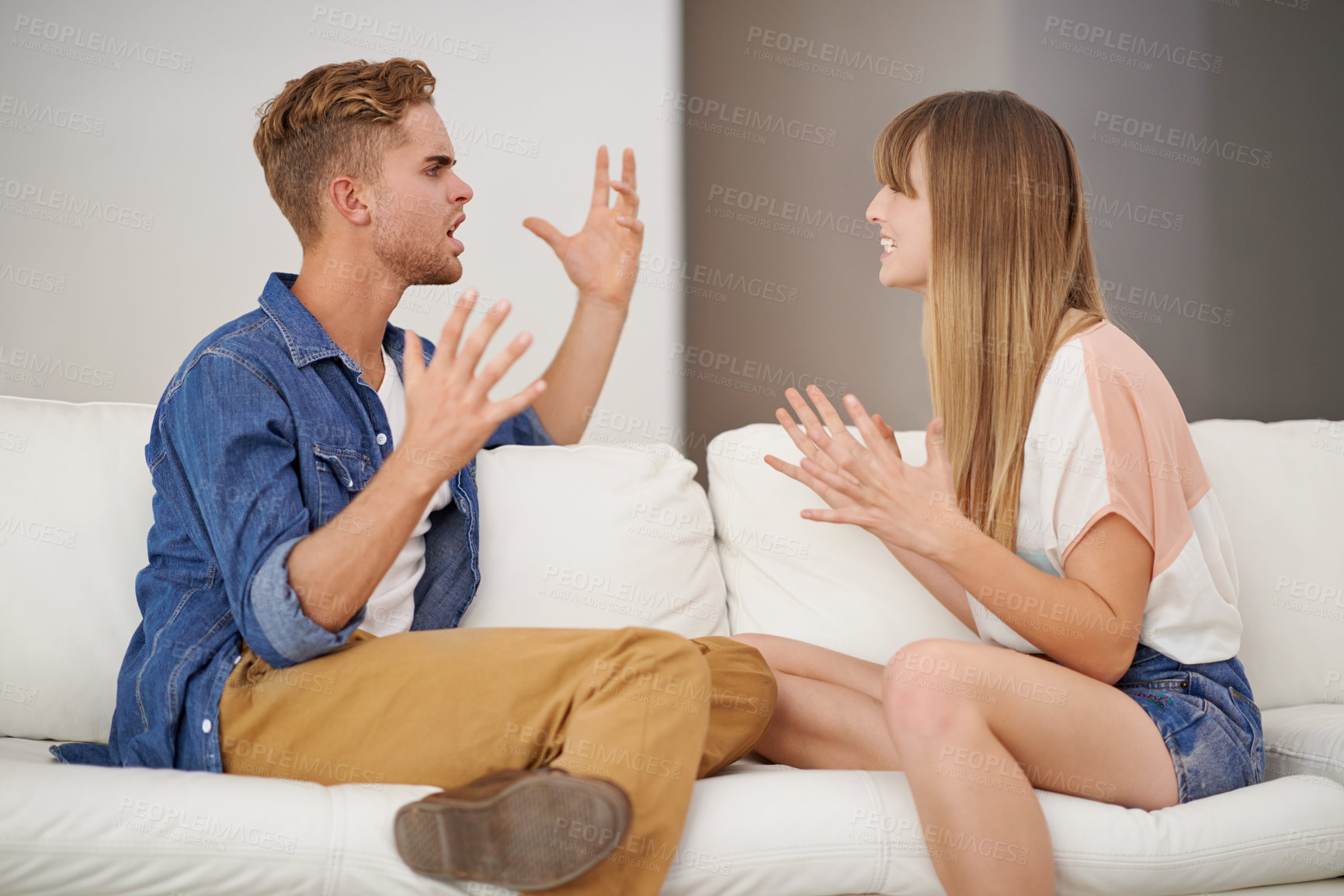 Buy stock photo Couple, fight and scream on couch with hands, anger and conflict in living room for communication. Man, woman and together on sofa in house to disagree on marriage, conversation and lifestyle