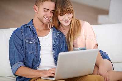 Buy stock photo Happy, couple and relax with laptop on sofa to watch movies with subscription for streaming in home. Online, man and woman reading on couch and scroll the news on website, blog or social media