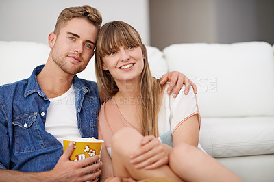 Buy stock photo Couple, watch and tv for movies, popcorn and smile on face, happiness and relax with film. Streaming, hug and sitting on floor, living room or lounge and together for love, relationship and date
