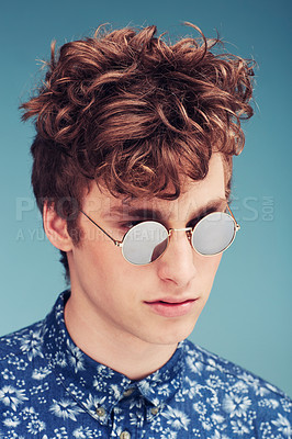 Buy stock photo Shot of a stylish man posing in a studio