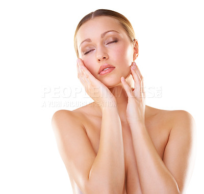 Buy stock photo Studio shot of a young model touching her face isolated on white