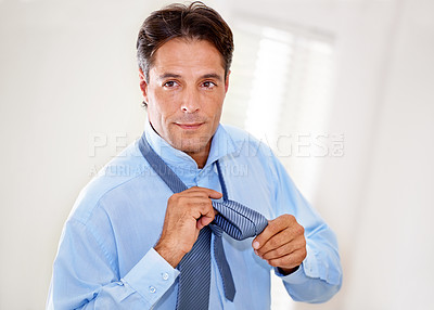 Buy stock photo Home, tying tie and businessman getting ready for career, job or entrepreneur preparation in the morning. Face, professional and dressing for work, serious person wear necktie or consultant in house