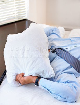 Buy stock photo Stress, pillow and tired with business man in bedroom for frustrated, fatigue and fear. Mistake, mental health and burnout with exhausted person in bed at home for overworked, sad and crisis