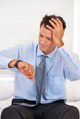 Buy stock photo Frustrated, watch and businessman late in home from mistake of oversleeping, insomnia and burnout. Male person, stress and headache with fear of time for appointment in corporate company and job