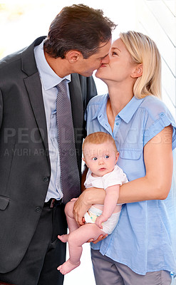 Buy stock photo Love, family and parents kiss with baby, bonding or affection at home on valentines day. Child, toddler or mother with father in romance for connection, care or healthy relationship together in house