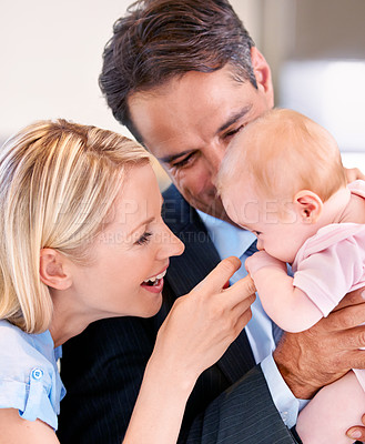 Buy stock photo Couple, love and closeup with home, baby and smile for happy, child and mother. Parents, daughter and kitchen with house kids and father for bonding, family and children with touch and holding 