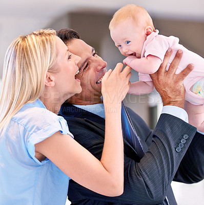 Buy stock photo Family, happy and parents with baby in living room for bonding, affection and childcare at home. Infant, smile and cheerful for interaction with mother, father and healthy relationship in house