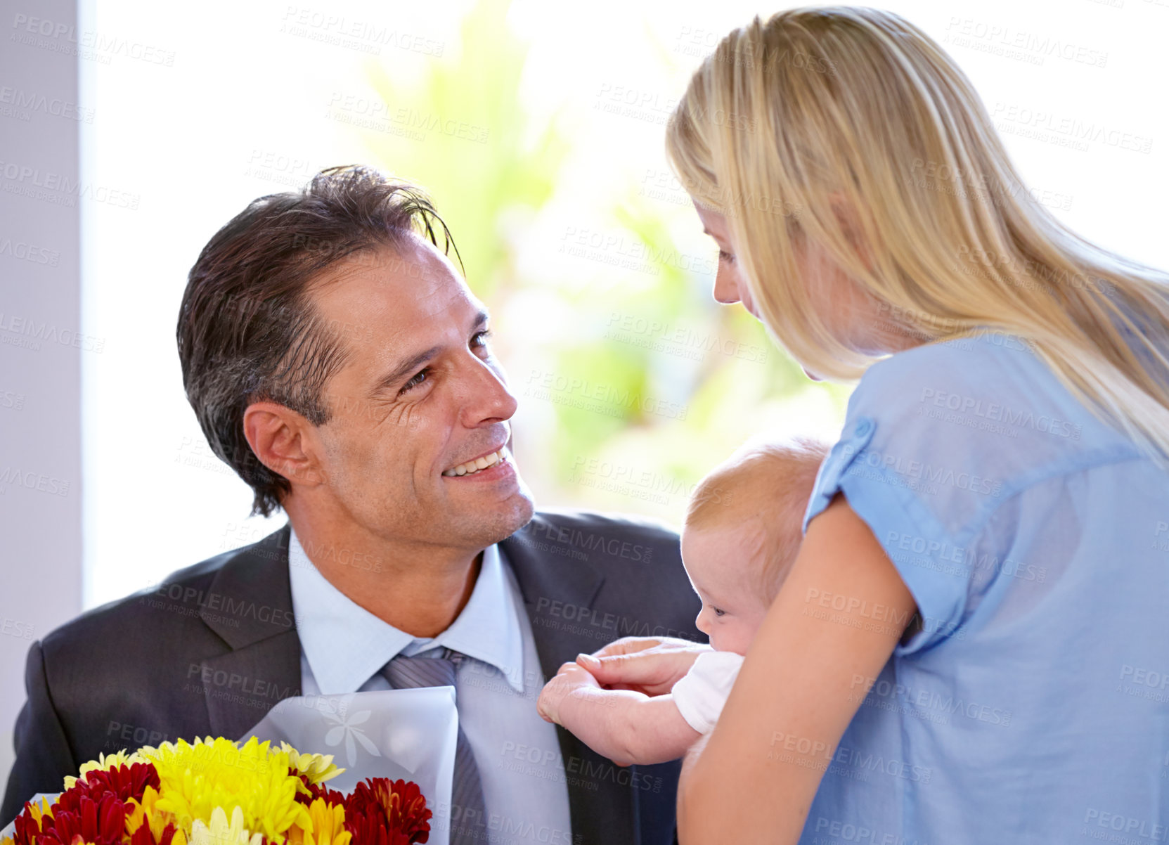 Buy stock photo Coming home with flowers, parents and baby in a house with love, support and bonding with gratitude. Happy family, bouquet and business man with floral surprise for first mothers day celebration