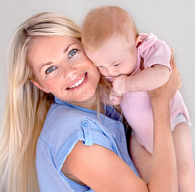 Buy stock photo Mother, child and smiling in portrait and embrace, bonding and security in connection at home. Mommy, daughter and happy while hugging on weekend, caring and family or affection or satisfaction
