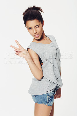 Buy stock photo Portrait, woman and peace sign with tongue in studio for fun, playful and humour with confidence. Female person, emoji and face with gesture for pose, fashion or expression on white background