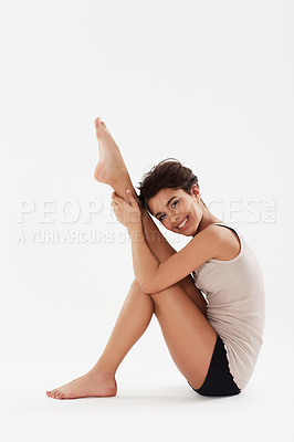 Buy stock photo A cute teenage dancer posing in studio with a big smile on her face