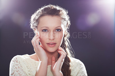 Buy stock photo A young elegant woman posing in a studio