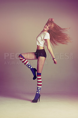 Buy stock photo Portrait of woman with socks, fashion and energy in retro art style on studio background with American flag. Beauty, underwear and carefree, sexy influencer model jumping in vintage fun mockup space.