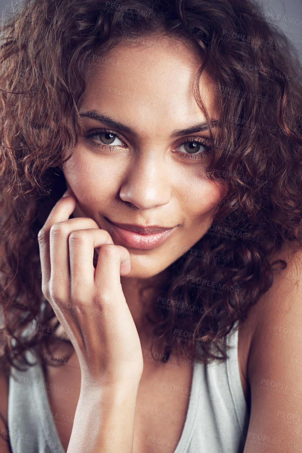 Buy stock photo Studio shot of a gorgeous young woman posing against a gray background