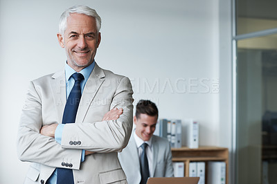Buy stock photo Senior businessman, portrait and confidence or mentor, agency and pride for training in office. Happy male person, arms crossed and smile for support in management, advisor and laptop for planning