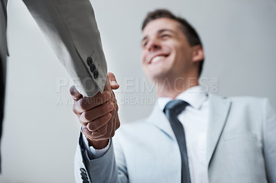 Buy stock photo Low angle, businessman and shaking hands with partner, colleague and smile for deal or promotion. Man, consult and hand for contract agreement, interview and advice for agency and office partnership