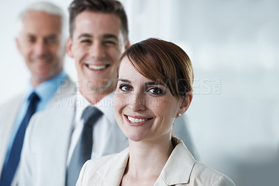 Buy stock photo Portrait of three corporate business people , standing in a row and in an office . Three diverse colleagues , standing in boardroom , employees , team leader and two men aged private company 