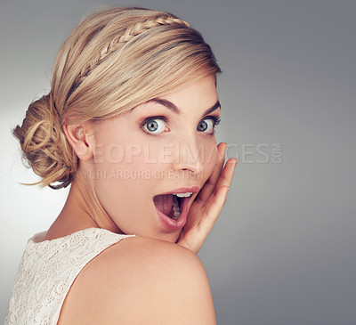 Buy stock photo Portrait of a beautiful young woman looking surprised in studio