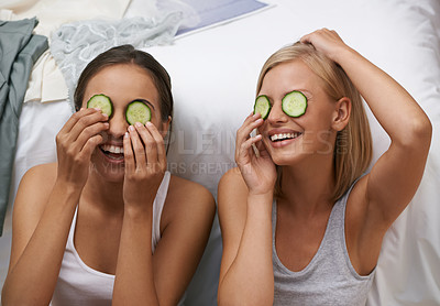 Buy stock photo Two young women pampering themselves at a sleepover