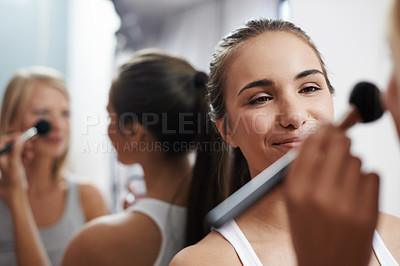 Buy stock photo Two young women pampering themselves at a sleepover