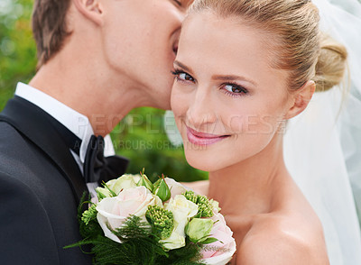 Buy stock photo Couple, kiss and portrait for wedding celebration in outdoors, together and smiling in nature. People, love and commitment to relationship with marriage, bouquet and romance at outside ceremony