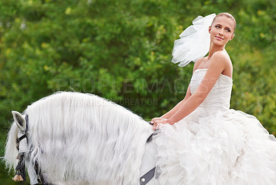 Buy stock photo Bride, woman and riding with horse outdoor or happiness for celebration, marriage or confidence on mockup space. Wedding, person and stallion on lawn in field with smile, dress and animal at ceremony