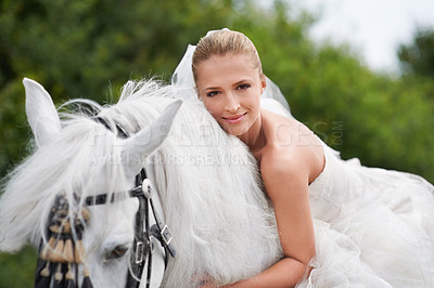 Buy stock photo Bride, woman and riding with horse or portrait outdoor with happiness for celebration, marriage and confidence. Wedding, person and stallion on lawn in field with smile, dress and animal at ceremony