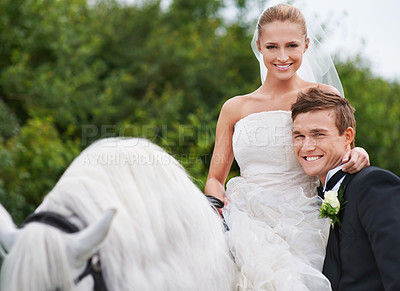 Buy stock photo Couple, marriage and horse with nature, countryside and celebration for love, portrait and smile. Groom, wife and uk forest with happiness, wedding and horse riding for honeymoon, vacation or holiday