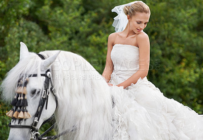 Buy stock photo Wedding, woman and riding with horse outdoor or thoughtful for celebration, marriage or confidence in countryside. Bride, person and stallion on lawn in field with smile, dress and animal at ceremony