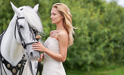 Buy stock photo Wedding, woman and smile with horse outdoor on grass for celebration, marriage or confidence in countryside. Bride, person and stallion on lawn in field with mockup space, dress or animal at ceremony