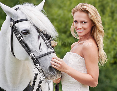 Buy stock photo Wedding, woman and portrait with horse outdoor for celebration, marriage and confidence in countryside. Bride, person and stallion on lawn in field with smile, dress and animal at ceremony in nature