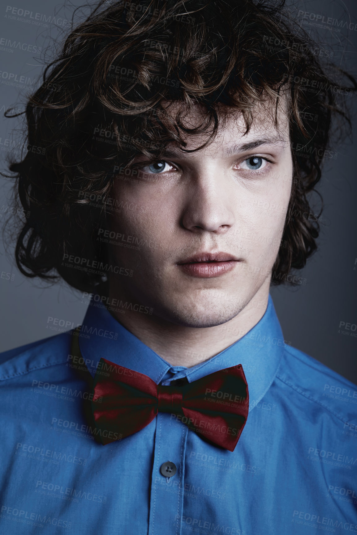 Buy stock photo Fashion, face of man in shirt and bow tie on studio background with aesthetic geek style and serious expression. Elegant beauty, formal and unique nerd clothes on gen z male model on grey backdrop.