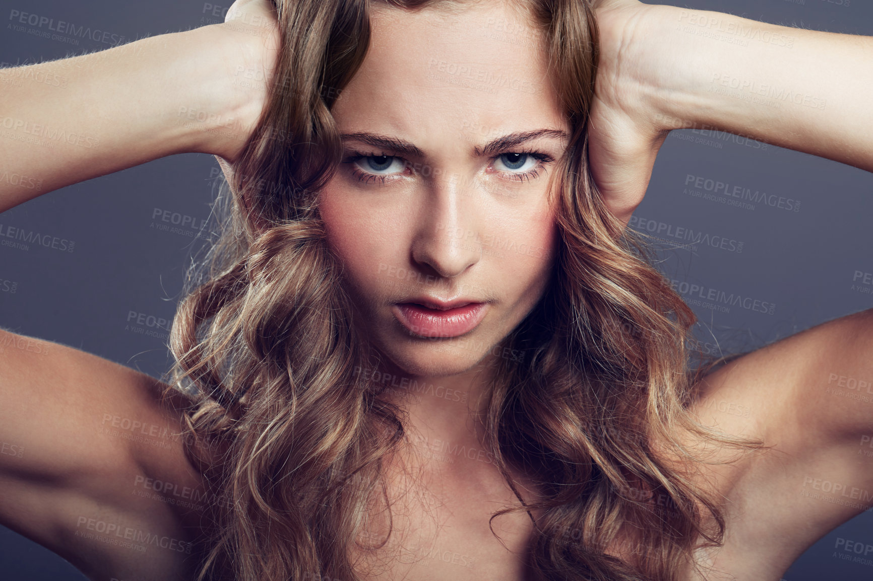 Buy stock photo Face, angry or frustrated young woman and in a studio background. Serious or concerned portrait, health wellness and female model  isolated alone with headshot in backdrop for skincare or cosmetic
