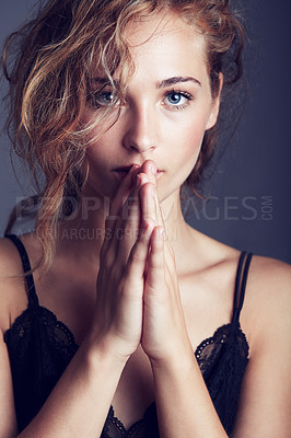 Buy stock photo Portrait, hands together and woman with lingerie, fashion and confident girl against studio background. Face, female person and model with wellness, prayer and hope with glamour, elegant and sensual