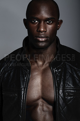 Buy stock photo Fashion, portrait and black man in leather jacket in studio isolated on a gray background. African male model, serious face and coat, confidence and stylish clothes or trendy outfit from Nigeria.