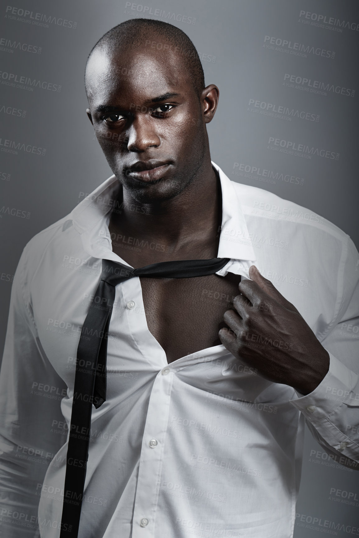 Buy stock photo Portrait, sexy and black man with muscle, body and wellness against a dark studio background. Face, male person and model with confidence, attractive and handsome with sensual look and muscular guy