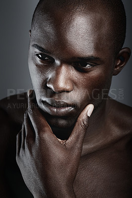 Buy stock photo An african male looking thoughtful in studio