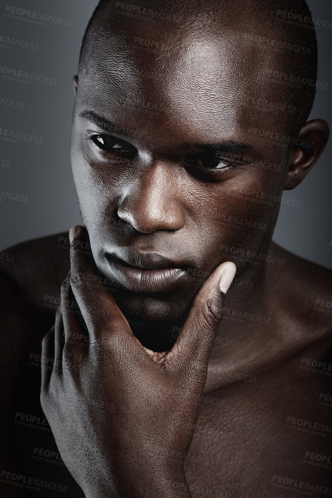 Buy stock photo An african male looking thoughtful in studio