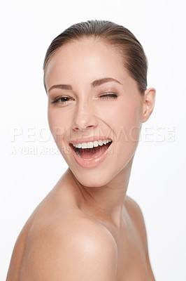 Buy stock photo Portrait, smile and woman wink for skincare, flirt or natural beauty isolated on white studio background. Face, blink and happy model in cosmetics excited for spa facial treatment for healthy skin