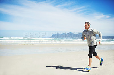 Buy stock photo Sand, space or man at beach running for exercise, training or outdoor workout at sea for fitness. Sports person, mature runner or healthy athlete in nature for cardio endurance, wellness or mockup