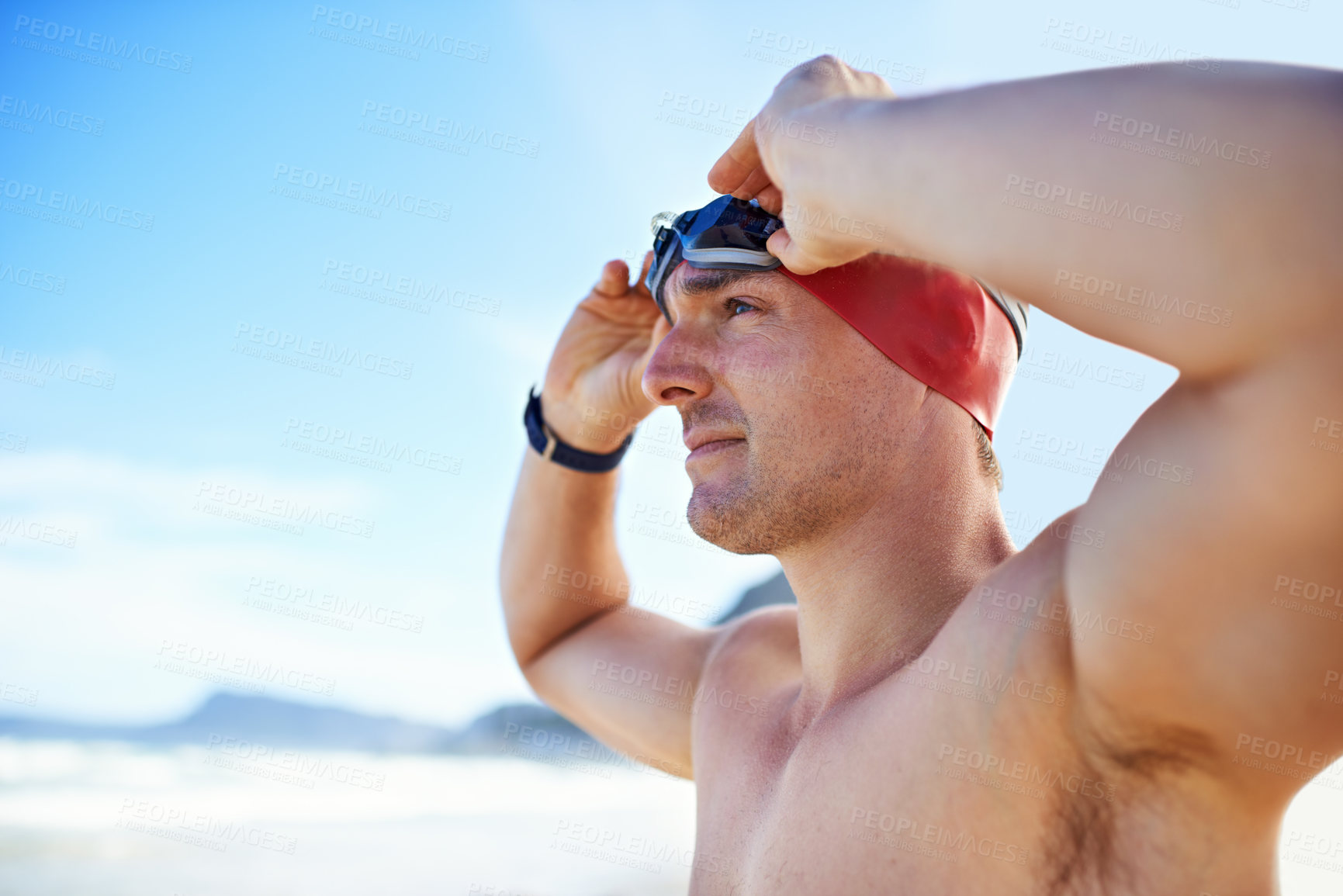 Buy stock photo Beach, goggles and man with vacation, cap and swimmer with holiday and summer break with getaway trip. Person, athlete and player with protection and seaside with sunshine and fitness with wellness