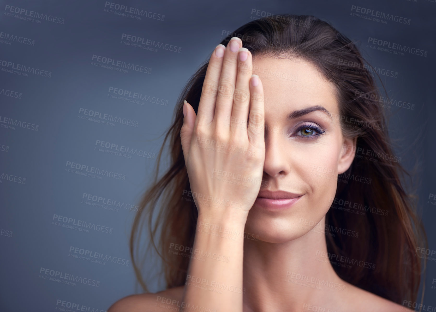 Buy stock photo Makeup, smile and hand on face of woman in studio for beauty, comparison or makeover on grey background. Half, portrait and female model with glowing skin, wellness or glamour treatment results