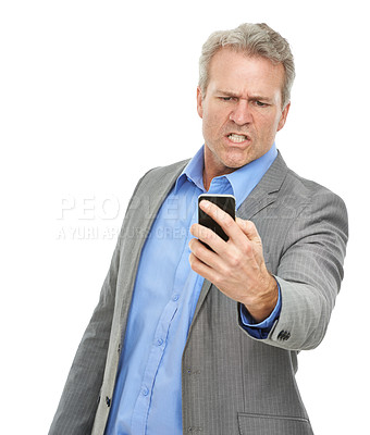 Buy stock photo Studio shot of an upset-looking businessman reading a text message