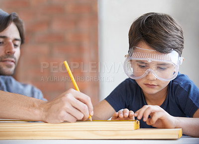 Buy stock photo Father, kid and woodwork at home for project, bonding and building with safety gear. Dad, son and carpenter for renovating, measuring and teaching with help for development of house with goggles