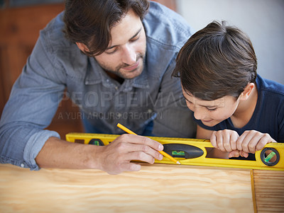 Buy stock photo Father, kid and wood work at home for carpenter, bonding and building with safety gear. Dad, son and builder for renovating, measuring and teaching moment for development of house with learning 
